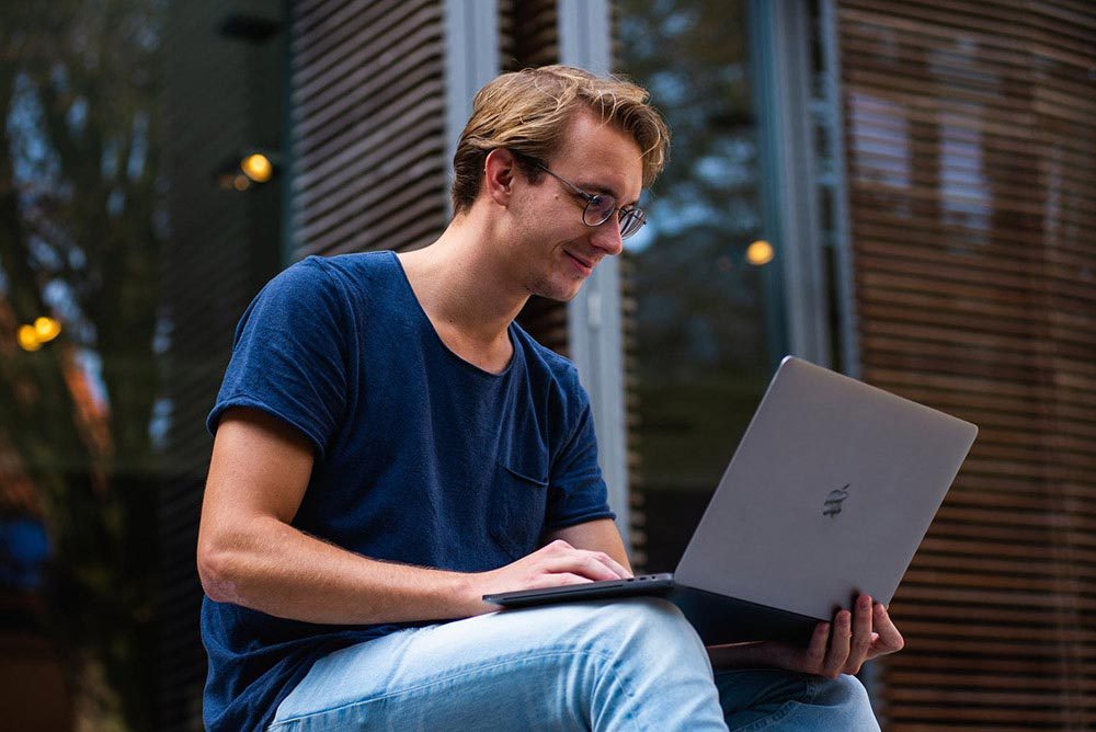 A person working on a laptop.