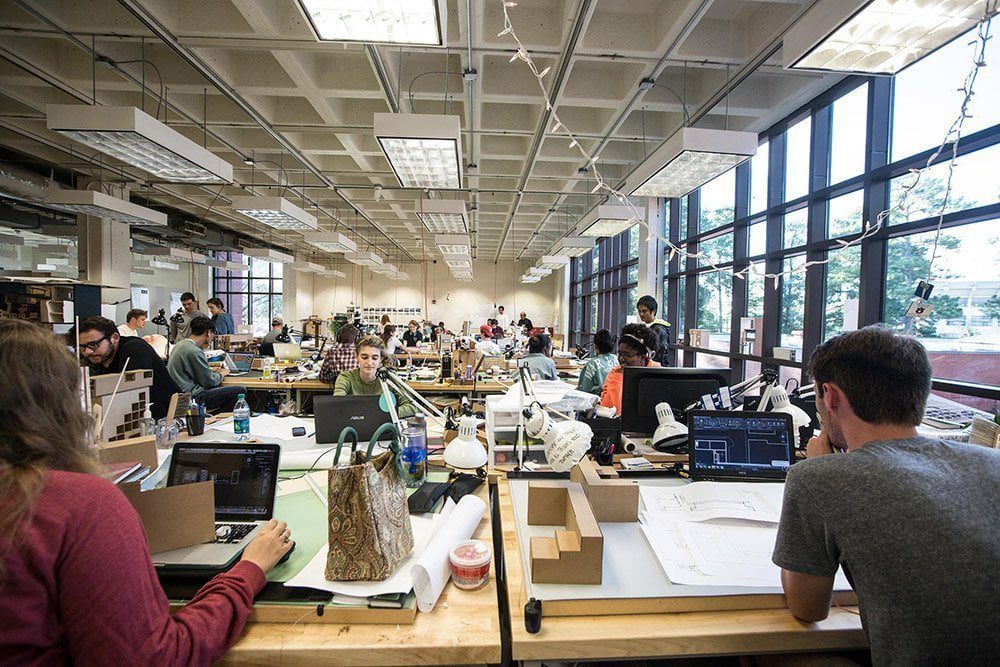 Architecture students working together in a studio.