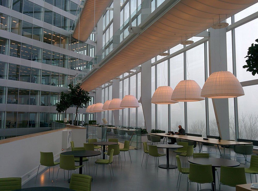 a covered link-way between office blocks used as an informal co-working area.