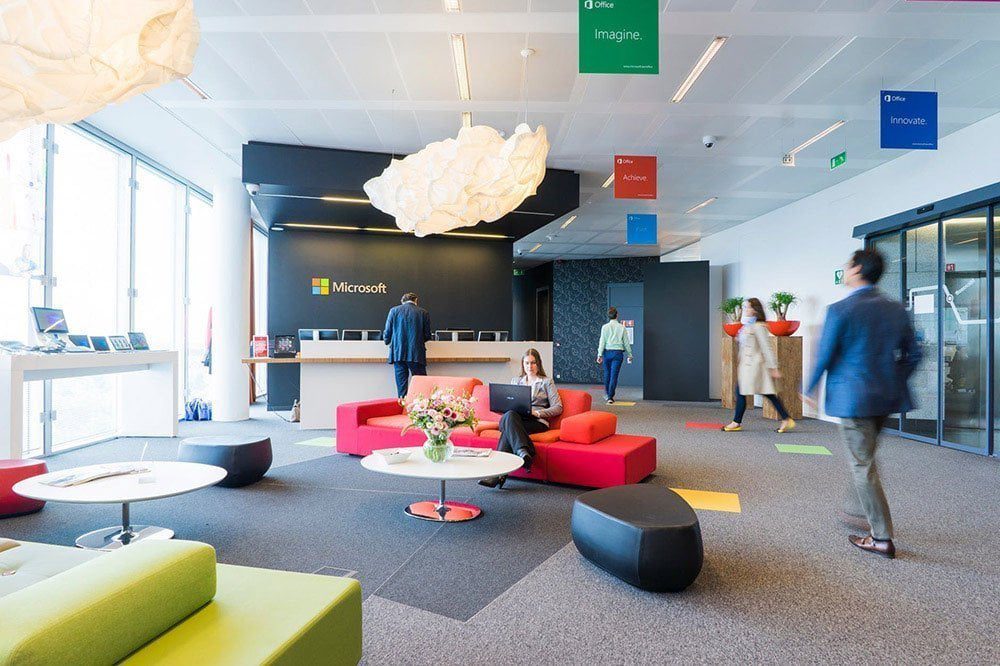 A contemporary office interior with varied seating and open circulation.